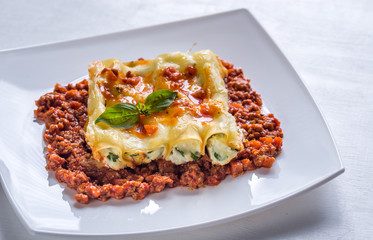 Canelloni stuffed with ricotta with bolognese sauce