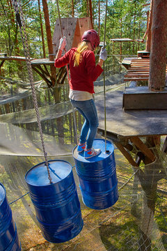 Girl in a Forest Rope Park Challenge