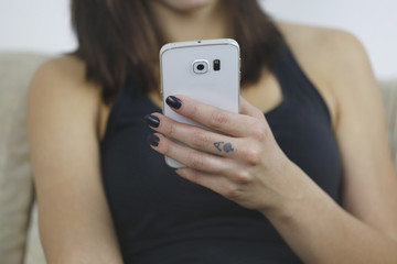 Woman use new mobile phone with one hand