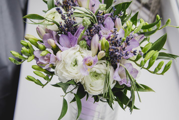 Luxure beautiful bouquet of buttercup ranunculus, fresia, lavender flowers on white background. Wedding style concept. Still life, rustic. 