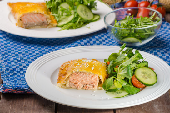 Salmon baked in puff pastry