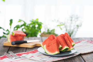 Slices of watermelon on wooden table 