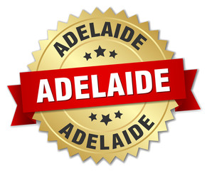 Adelaide round golden badge with red ribbon