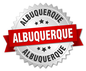 Albuquerque round silver badge with red ribbon