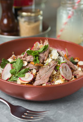 Roasted organic leg of lamb salad, served with radish, quinoa and feta cheese.