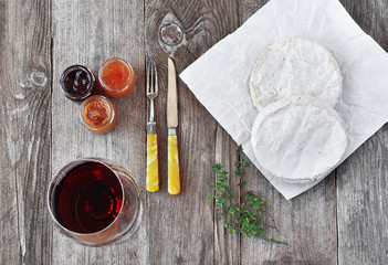 French soft cheese with a different jam and a glass of red wine