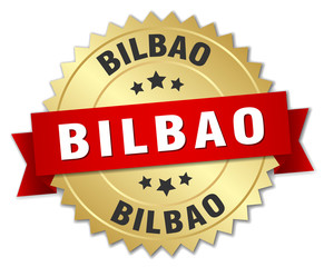 Bilbao round golden badge with red ribbon