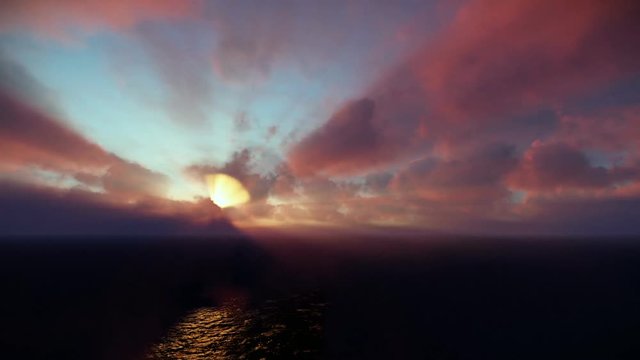Beautiful sunrise over clouds and ocean, godrays