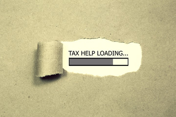 tax help appearing behind torn black paper