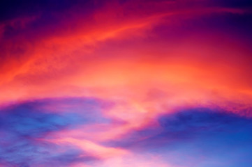 Sunset with orange zigzag clouds.