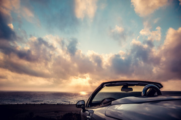 Cabriolet against blue sky background