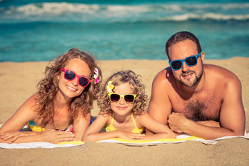 Fototapeta premium Happy family having fun on the beach