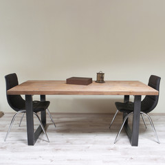 modern wooden table in the loft interior 