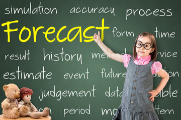 Cute little girl wearing business dress and showing forecast concept on green chalk board.