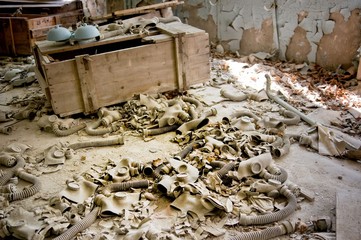 Gas masks lay scattered on the floor of abandoned building, Pripyat, Chernobyl Exclusion Zone,...