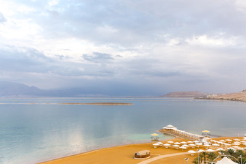 Fototapeta na wymiar Dead sea beach shore tourist hotels, Ein Bokek.