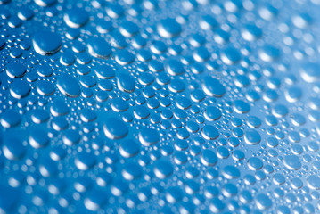 close-up of water drops on the blue background 
