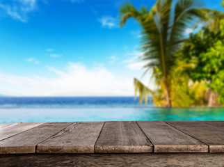 Naklejka na ściany i meble Empty wooden planks with blur beach on background