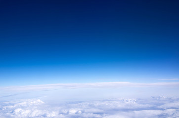 Fototapeta na wymiar Blue sky background with tiny clouds