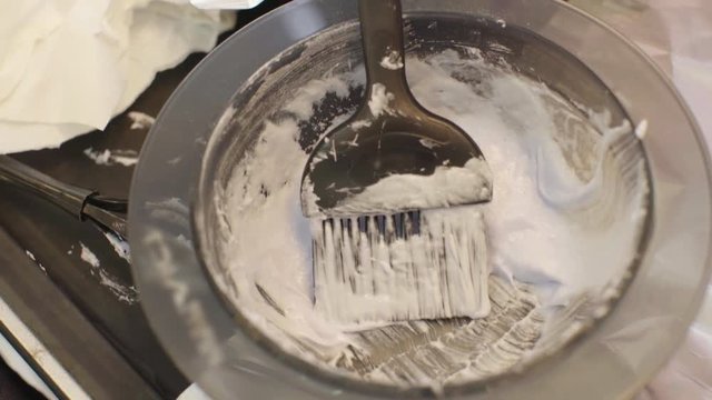 Brush Hair Coloring in a Bowl of Paint