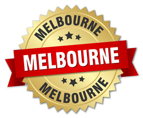Melbourne round golden badge with red ribbon