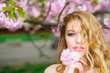 Pretty woman in pink blossom