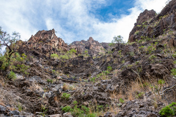 Ascent in the Argaga Canyon. The Barranco de Argaga is next to the Valle Gran Rey. The trail is heavy to hike and with the steep slopes a bit dangerous to go.  It is a steeply path through the gorge