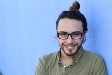 Happy and smiling young man's portrait with copy space