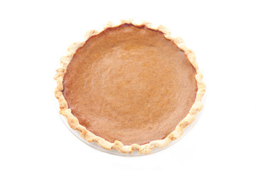 top view of pumpkin pie over white background.