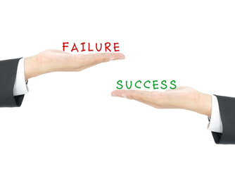Success vs Failure on hand of business man