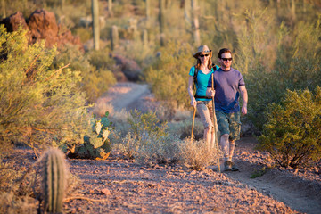 Two Afternoon Hikers on Rugged Desert Trail