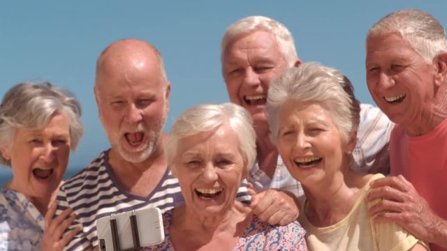 Group of mature people taking a photo