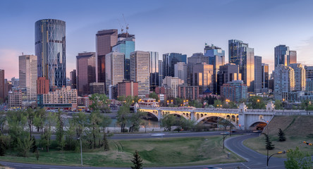Fototapeta na wymiar Calgary skyline at night with Bow River and Centre Street Bridge.