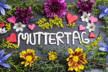 muttertag, written with plasticine surrounded by flowers