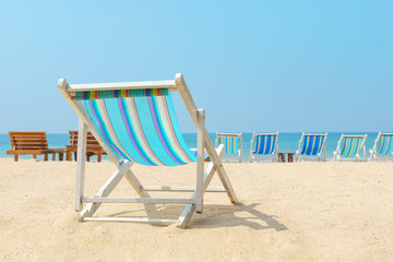 canvas beach bed on the beach with nice sky and cloud