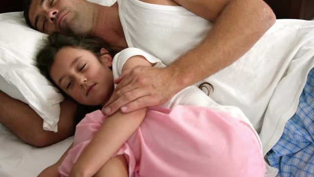 Dad and daughter sleeping