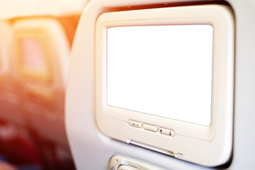 Aircraft monitor in passenger seat isolated on white background
