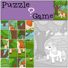 Little cute pony stands near the apple tree.