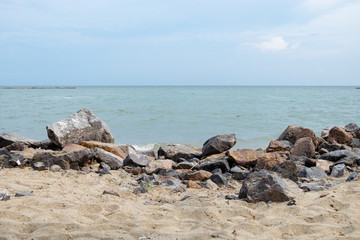 Fototapeta na wymiar Many big rock sand beach horizon