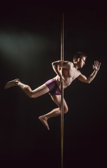 Obraz na płótnie Canvas Pole Dance Male Athlete