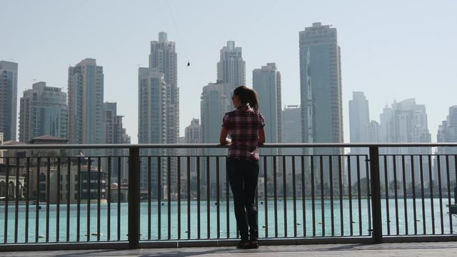 Woman on the waterfront in Dubai