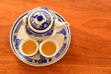 Tea set on the wooden floor .