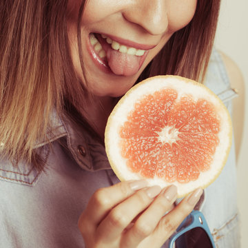 Happy Woman Eating Grapefruit. Diet Food.