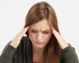 Young woman with painful headache