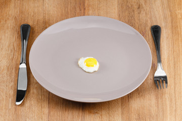 Small fried egg on a plate
