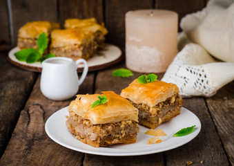 Walnuts baklava on wooden background. East sweets. Ramadan food. Selective focus