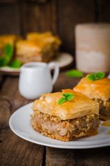 Walnuts baklava on wooden background. East sweets. Ramadan food. Selective focus