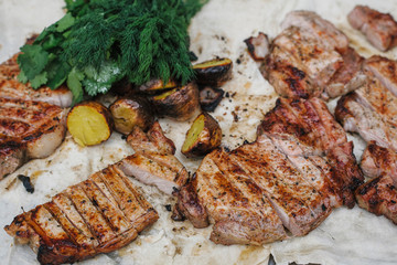 Grilled steak, bacon and potatoes with herbs lies in the pita. The concept of eating outdoors in the weekend.
