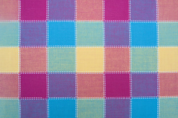 The texture of the textile colored squares of cloth