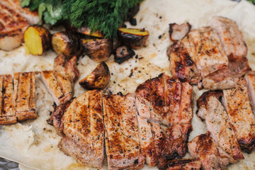 Grilled steak, bacon and potatoes with herbs lies in the pita. The concept of eating outdoors in the weekend.
